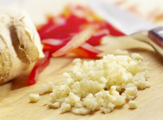 chopped onion on a wooden plank