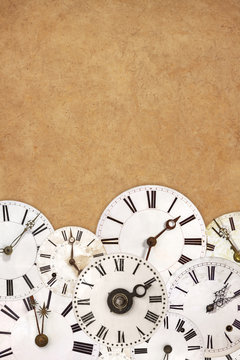 Set of vintage white clock faces on an ancient background