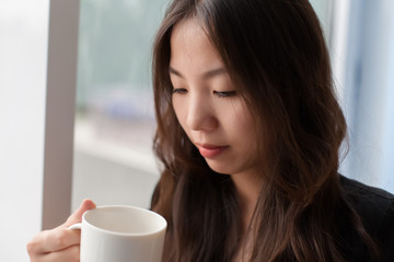 young girl with a cup