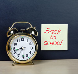 alarm clock and sticker with text back to school