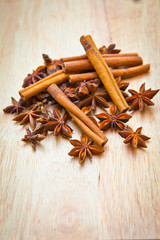 Vanilla sticks and star anise on a wooden board
