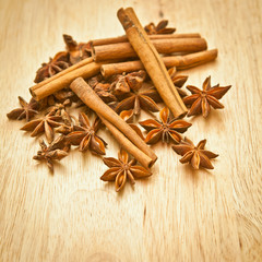 Vanilla sticks and star anise on a wooden board