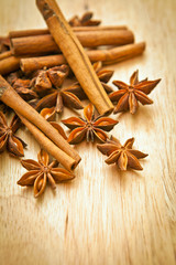 Vanilla sticks and star anise on a wooden board