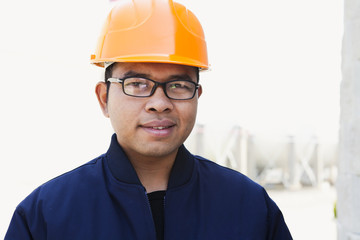 Portrait of young asian engineer over white background