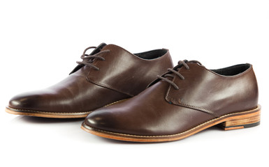 Brown man's shoes isolated on white background.  Pair of brown m