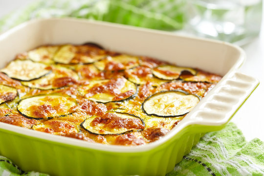 casserole with cheese and zucchini in baking dish