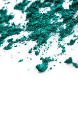 Crushed green eye shadow on white background