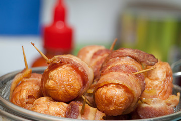 Sausages wrapped in bacon