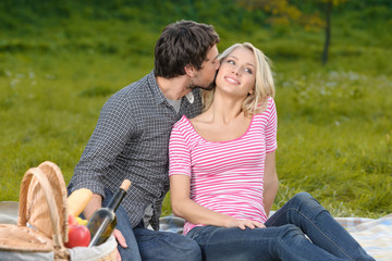 Loving couple in park. Loving young couple having a great time t