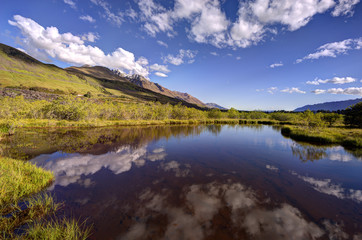 Fototapeta na wymiar Reflection of the mountains on the pond at Glenorchy