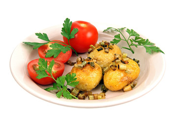 roasted potatoes with tomatoes.