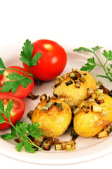 roasted potatoes with tomatoes.