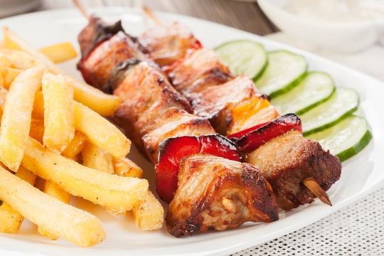 Grilled shashlik with french fries