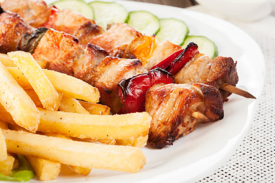Grilled shashlik with french fries
