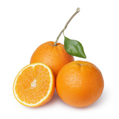 ripe round oranges with half, stem and leaf