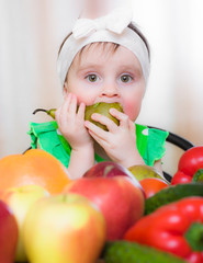 Happy Kid with vegetables and fruits.