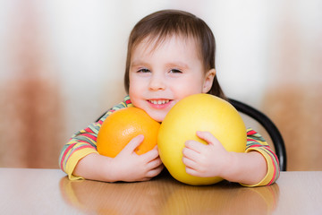 Fototapeta premium Happy Kid with pomelo