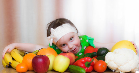 Fototapeta na wymiar Happy Kid with vegetables and fruits.