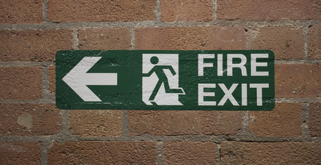 Fire Exit sign on bricks