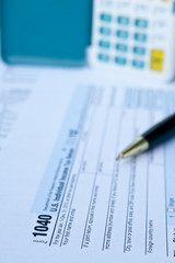 Naklejka na ściany i meble U.S. Tax form, pen and calculator