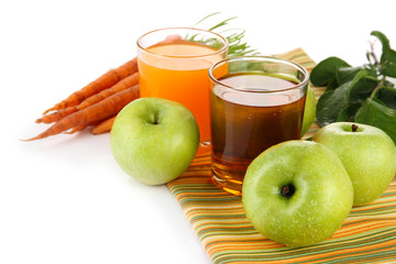 Glasses of juice, apples and carrots, isolated on white