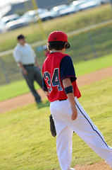 Baseball boy on the field during game