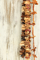 Dried mushrooms on wooden background