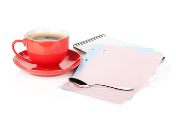 Coffee cup, spoon and office supplies