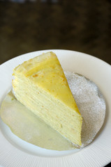 Vanilla crepe cake in white dish