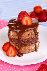 Chocolate cake with strawberry on table close-up