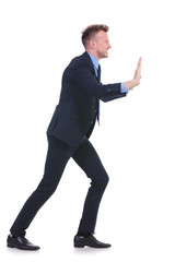 business man pushes imaginary wall