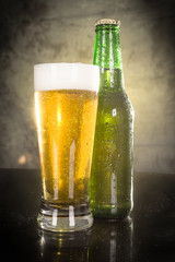 Close up of beer bottle and glass