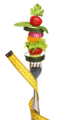 Mixed vegetables on a fork isolated. Diet concept