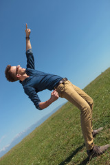 casual man points at the sky