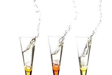 touch glasses with champagne splashing