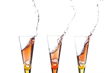 touch glasses with champagne splashing