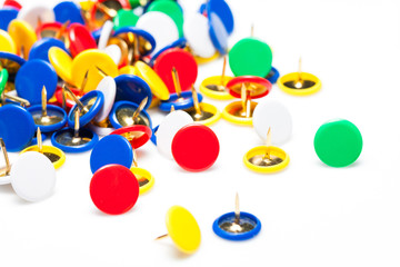 Colorful push pins on white background