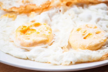 Double star eggs serving on white plate