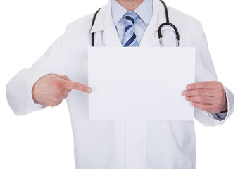 Portrait Of Male Doctor Holding Placard