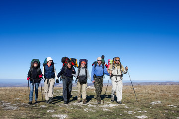 Group of hikers is walking on top of mountain in Crimea mountain