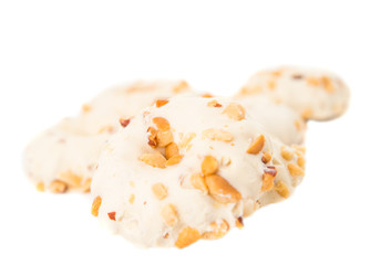 Cookies in white chocolate with nuts