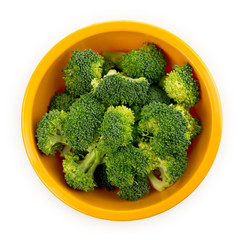 Chopped broccoli in a bowl isolated on white