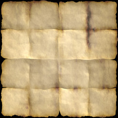Aged vintage grunge paper with burnt sides isolated on black