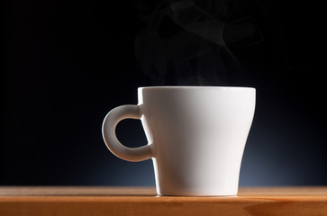 White coffee cup on wooden table