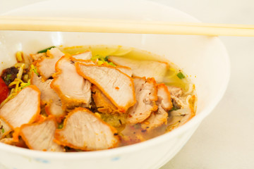 Closeup of Roast red pork noodle .