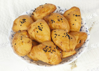 Small loaf with cheese and seasem