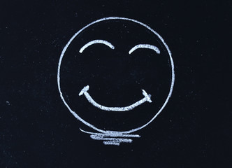 smiley face on blackboard