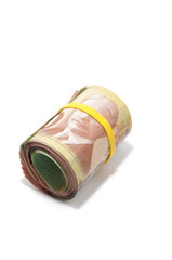 Roll of Canadian banknotes with 100 dollars at the surface