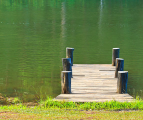 Fototapeta na wymiar Wooden bridge in the lagoon