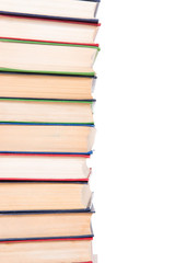 Multicolored books stack isolated on white background.